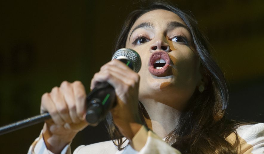 Rep. Alexandria Ocasio-Cortez, D-N.Y., addresses The Road to the Green New Deal Tour final event at Howard University in Washington, Monday, May 13, 2019. (AP Photo/Cliff Owen)