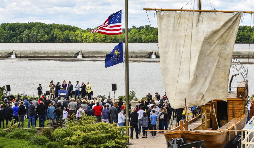 A replication keel boat rests beside the crowd for an announcement Monday, May 13, 2019, for the extension of the Lewis and Clark National Historic trail. A sprawling 4900 miles creates the trail, which will now be joined by the Southern Indiana stops along the way. (Tyler Stewart/News and Tribune via AP)