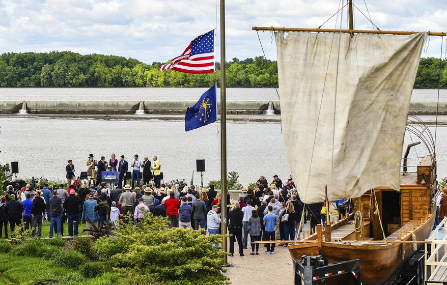 A replication keel boat rests beside the crowd for an announcement Monday, May 13, 2019, for the extension of the Lewis and Clark National Historic trail. A sprawling 4900 miles creates the trail, which will now be joined by the Southern Indiana stops along the way. (Tyler Stewart/News and Tribune via AP)