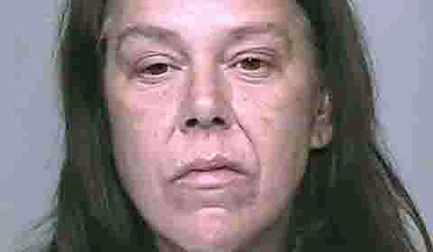 This undated booking photo provided by the Scottsdale Police Department shows 46-year-old Holly Brennan. Scottsdale police say Brennan has been arrested on suspicion of first-degree murder after telling officers she smothered her 79-year-old mother in the apartment they shared.(Scottsdale Police Department via AP)