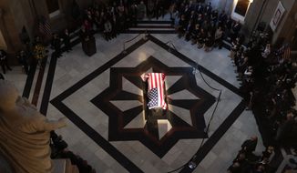 The casket of Sen. Richard Lugar is illuminated in the Indiana Statehouse rotunda in Indianapolis, Tuesday, May 14, 2019. Lugar was a longtime Republican senator and former Indianapolis mayor who&#39;s been hailed as an &amp;quot;American statesman&amp;quot; since he died April 28 at age 87. (AP Photo/Michael Conroy)
