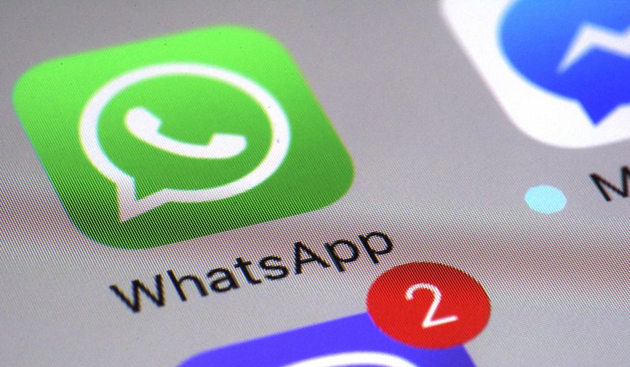 This Friday, March 10, 2017, file photo shows the WhatsApp communications app on a smartphone, in New York. WhatsApp says a vulnerability in the popular communications app lets mobile phones be infected with sophisticated spyware with a missed in-app call alone. (AP Photo/Patrick Sison, File)