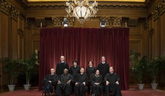 FILE - In this Nov. 30, 2018, file photo, the justices of the U.S. Supreme Court gather for a formal group portrait to include a new Associate Justice, top row, far right, at the Supreme Court Building in Washington. Seated from left: Associate Justice Stephen Breyer, Associate Justice Clarence Thomas, Chief Justice of the United States John G. Roberts, Associate Justice Ruth Bader Ginsburg and Associate Justice Samuel Alito Jr. Standing behind from left: Associate Justice Neil Gorsuch, Associate Justice Sonia Sotomayor, Associate Justice Elena Kagan and Associate Justice Brett M. Kavanaugh. Alabama’s virtual ban on abortion is the latest and most far-reaching state law seemingly designed to prod the Supreme Court to reconsider a constitutional right it announced 46 years ago in the landmark Roe v. Wade decision. (AP Photo/J. Scott Applewhite, File)