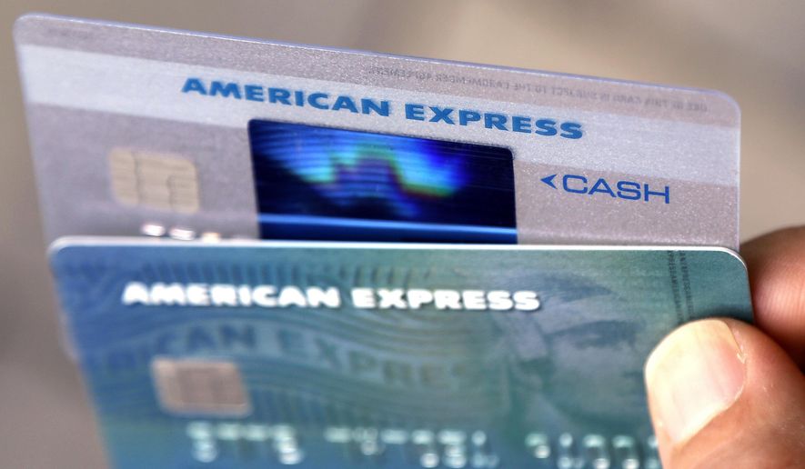 FILE - In this July 18, 2016, file photo, American Express credit cards are photographed in North Andover, Mass. American Express is buying the online reservation startup Resy, the companies announced Wednesday, May 15, 2019, the latest move by AmEx to establish and maintain a foothold for its card members in some of the world's most desired restaurants. (AP Photo/Elise Amendola, File)