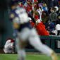Philadelphia Phillies right fielder Bryce Harper, left, collides with the wall after catching a pop-foul by Milwaukee Brewers&#39; Keston Hiura, right, during the sixth inning of a baseball game, Tuesday, May 14, 2019, in Philadelphia. Milwaukee won 6-1.(AP Photo/Matt Slocum)
