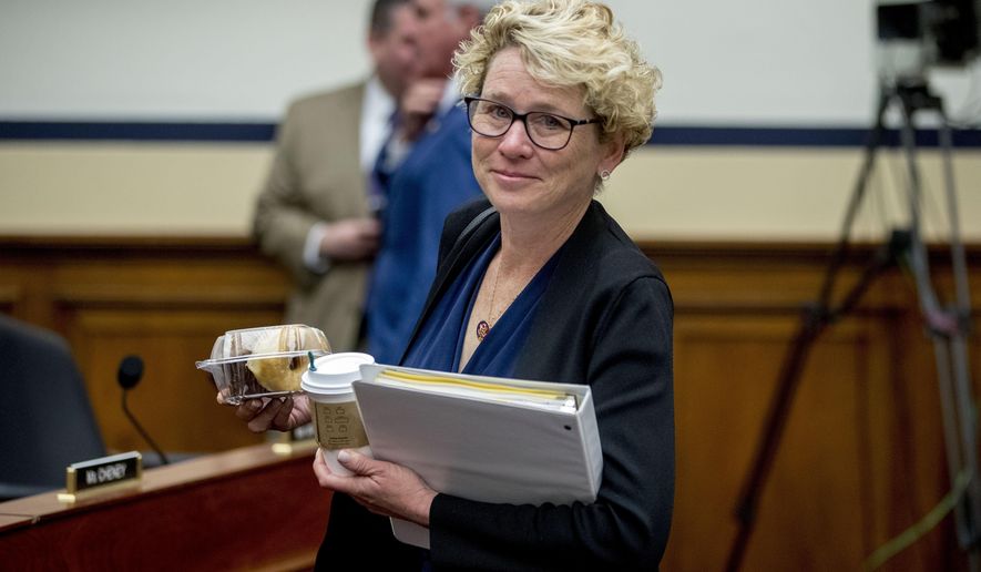 FIEL - In this April 2, 2019, file photo, Rep. Chrissy Houlahan, D-Pa., arrives for a House Armed Services Committee budget hearing for the Departments of the Army and Air Force on Capitol Hill in Washington. Congresswomen with military service in their past, some of them forged on post-Sept. 11 wars, are hoping to create their own caucus to drive an agenda to support the nation’s growing ranks of female service members. (AP Photo/Andrew Harnik, File)