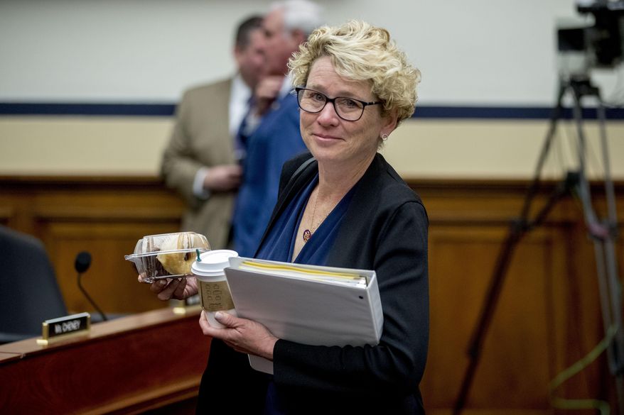 FIEL - In this April 2, 2019, file photo, Rep. Chrissy Houlahan, D-Pa., arrives for a House Armed Services Committee budget hearing for the Departments of the Army and Air Force on Capitol Hill in Washington. Congresswomen with military service in their past, some of them forged on post-Sept. 11 wars, are hoping to create their own caucus to drive an agenda to support the nation’s growing ranks of female service members. (AP Photo/Andrew Harnik, File)