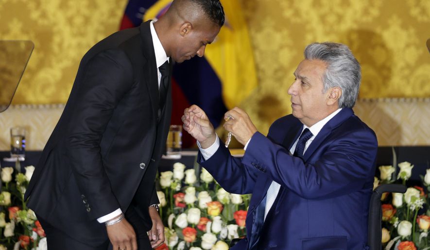 Ecuador&#39;s President Lenin Moreno, right, decorates soccer star Antonio Valencia with a National Order of Merit, in Quito, Ecuador, Tuesday, May 14, 2019. The Ecuadorian&#39;s final game with Manchester United was Sunday, after 10 seasons with the team. (AP Photo/Dolores Ochoa)