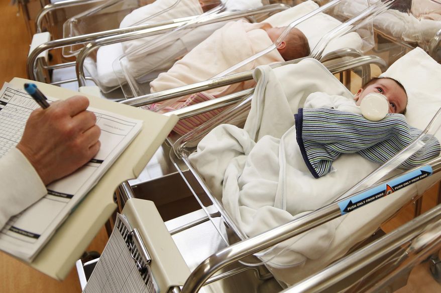 This Feb. 16, 2017, file photo shows newborn babies in the nursery of a postpartum recovery center in upstate New York. According to a government report released Wednesday, May 15, 2019, U.S. birth rates reached record lows for women in their teens and 20s, leading to the fewest babies in 32 years. (AP Photo/Seth Wenig, File) **FILE**