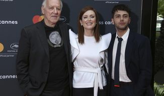 Director Werner Herzog, from left, actress Julianne Moore and Xavier Dolan pose for photographers at the See The World Through A Different Lens photo call at the 72nd international film festival, Cannes, southern France, Wednesday, May 15, 2019. (Photo by Joel C Ryan/Invision/AP)