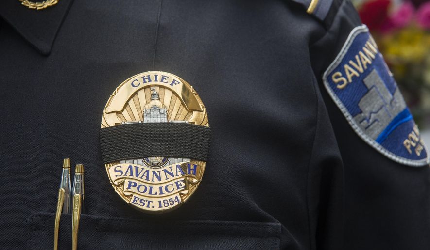 Savannah (Ga)., Police Chief Roy Minter wears a black band over his badge at a memorial ceremony on Monday, May 13, 2019, honoring slain Savannah police Sgt. Kelvin Ansari. (Will Peebles/Savannah Morning News via AP)
