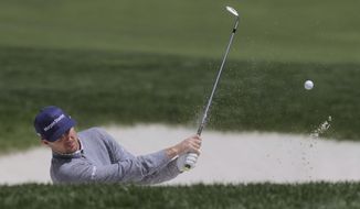 Justin Rose, of England, hits out of a bunker on the ninth hole during a practice round for the PGA Championship golf tournament, Wednesday, May 15, 2019, at Bethpage Black in Farmingdale, N.Y. (AP Photo/Charles Krupa)