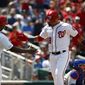 Washington Nationals&#39; Howie Kendrick, left, greets teammate Gerardo Parra after scoring on Parra&#39;s two-run home run in the fifth inning of a baseball game against the New York Mets, Thursday, May 16, 2019, in Washington. (AP Photo/Patrick Semansky)