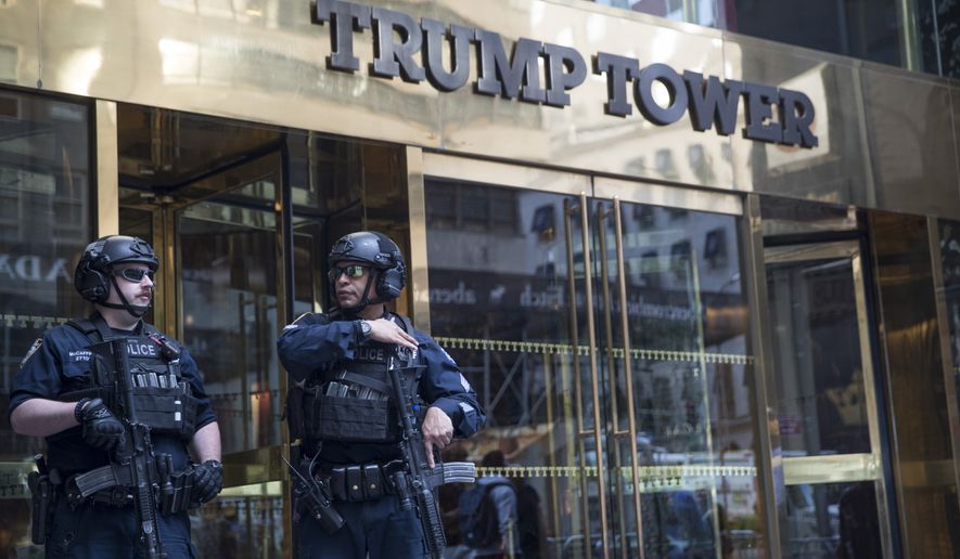 Heavily armed police officers stand guard outside Trump Tower, Thursday, May 16, 2019, in New York. President Donald Trump is attending a fund raiser in New York City Thursday and will spend the night at Trump Tower. (AP Photo/Mary Altaffer)