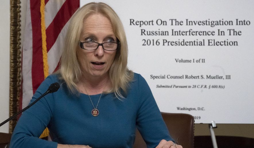 House Judiciary Committee member Rep. Mary Gay Scanlon, D-Pa., begins a complete reading of the report by special counsel Robert Mueller on Russian election interference, at the Capitol in Washington, Thursday, May 16, 2019. (AP Photo/J. Scott Applewhite)