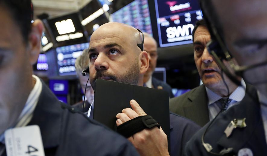 FILE - In this May 9, 2019, file photo trader Fred DeMarco works on the floor of the New York Stock Exchange. The U.S. stock market opens at 9:30 a.m. EDT on Thursday, May 16. (AP Photo/Richard Drew, File)