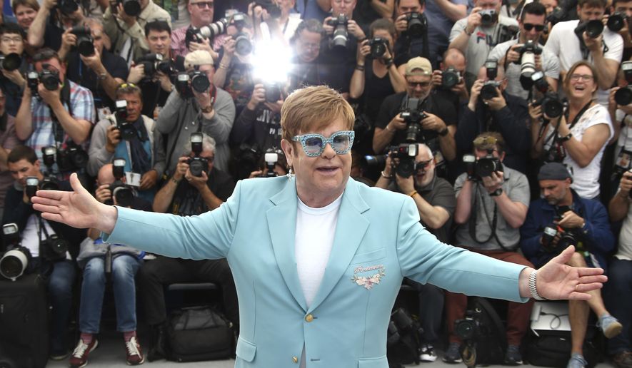 Singer Elton John poses for photographers at the photo call for the film 'Rocketman' at the 72nd international film festival, Cannes, southern France, Thursday, May 16, 2019. (Photo by Joel C Ryan/Invision/AP)