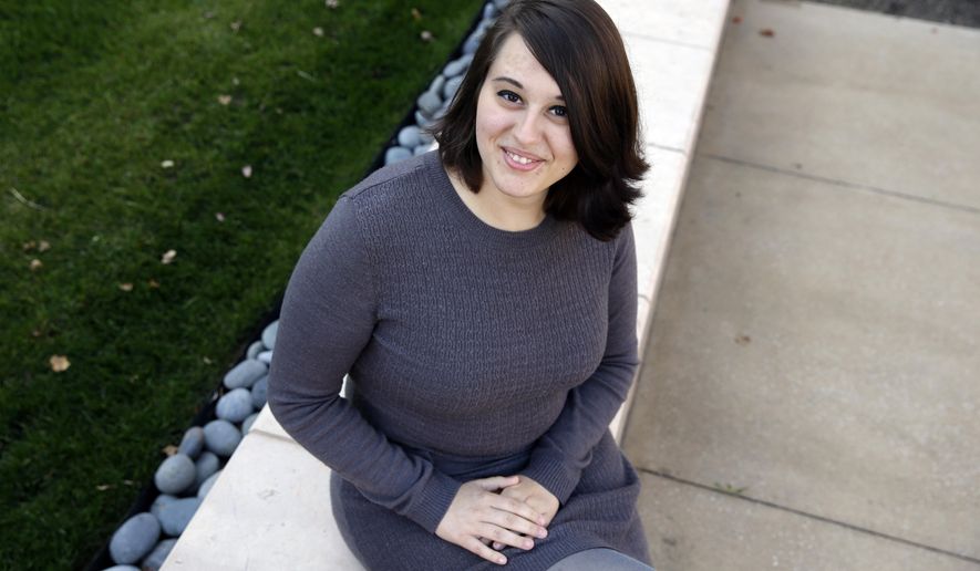 FILE - In this Wednesday, Nov. 4, 2015 file photo, Miranda Taylor, 20, poses for a portrait outside Christ College of Nursing and Health Science in Cincinnati. When she was 16 and weighed 265 pounds, she had obesity surgery. Taylor lost more than 100 pounds, along with severe depression, pre-diabetes and an obesity-related hormonal condition. "I feel awesome. It's like a new life," she says. (AP Photo/Michael Conroy)