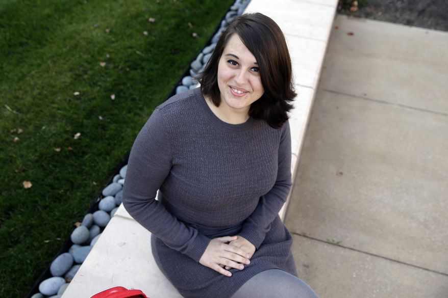 FILE - In this Wednesday, Nov. 4, 2015 file photo, Miranda Taylor, 20, poses for a portrait outside Christ College of Nursing and Health Science in Cincinnati. When she was 16 and weighed 265 pounds, she had obesity surgery. Taylor lost more than 100 pounds, along with severe depression, pre-diabetes and an obesity-related hormonal condition. "I feel awesome. It's like a new life," she says. (AP Photo/Michael Conroy)