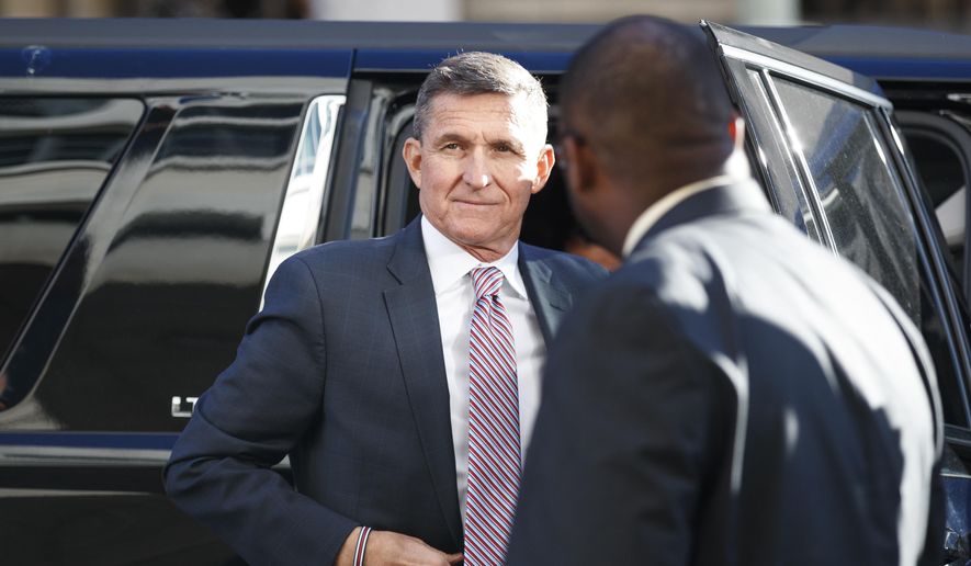 In this Dec. 18, 2018, file photo, President Donald Trump&#x27;s former National Security Adviser Michael Flynn arrives at federal court in Washington. (AP Photo/Carolyn Kaster, File)