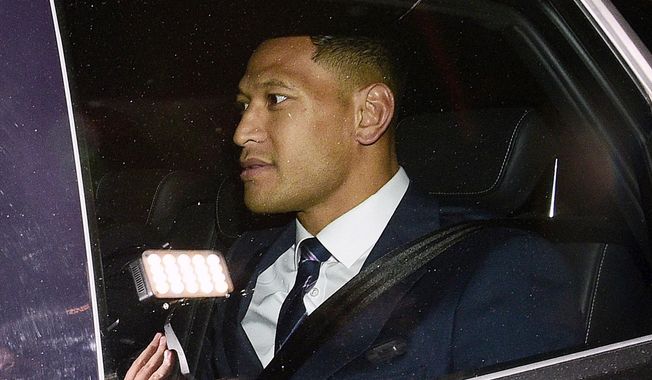 Australian rugby union player Israel Folau leaves a Code of Conduct hearing in Sydney, Sunday, May 5, 2019. The 30-year-old Folau appeared before the hearing to fight Rugby Australia&#x27;s decision to terminate his contract after he posted in mid-April on social media that gay people, along with other &amp;quot;sinners,&amp;quot; will face damnation unless they repent. (AAP Image/Bianca De Marchi)