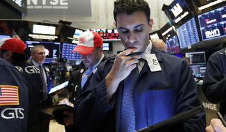 FILE - In this May 9, 2019, file photo trader Craig Spector works on the floor of the New York Stock Exchange. The U.S. stock market opens at 9:30 a.m. EDT on Friday, May 17. (AP Photo/Richard Drew)