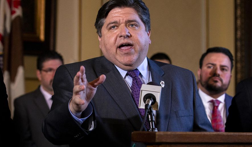 In this April 12, 2019, photo, Illinois Governor J.B. Pritzker answers questions after a bill signing in the governor's office at the Illinois State Capitol, in Springfield, Ill. (Justin L. Fowler/The State Journal-Register via AP) **FILE**