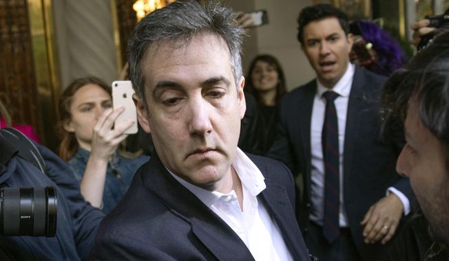 In this May 6, 2019, file photo, Michael Cohen, former attorney to President Donald Trump, leaves his apartment building before beginning his prison term in New York. Porn actress Stormy Daniels has agreed to dismiss a lawsuit that accused her former lawyer of colluding with Cohen to have her deny having an affair with Trump. A notice of agreement with Cohen and Daniels&#x27; ex-attorney, Keith Davidson, were filed Thursday, May 16, with a Los Angeles court. (AP Photo/Kevin Hagen, File)