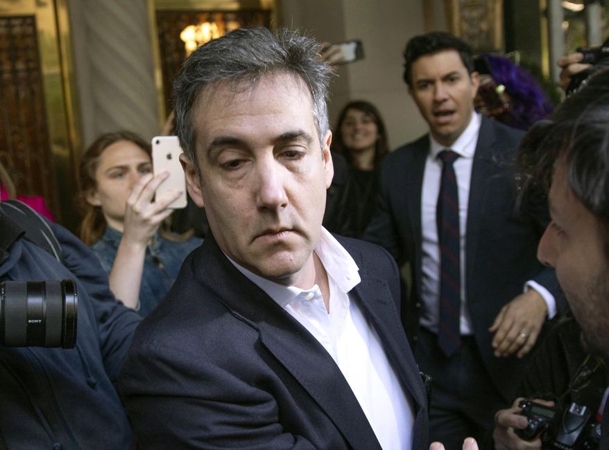 In this May 6, 2019, file photo, Michael Cohen, former attorney to President Donald Trump, leaves his apartment building before beginning his prison term in New York. Porn actress Stormy Daniels has agreed to dismiss a lawsuit that accused her former lawyer of colluding with Cohen to have her deny having an affair with Trump. A notice of agreement with Cohen and Daniels&#39; ex-attorney, Keith Davidson, were filed Thursday, May 16, with a Los Angeles court. (AP Photo/Kevin Hagen, File)