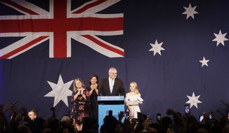 Australian Prime Minister Scott Morrison, second right, arrives on stage to speak to party supporters flanked by his wife, Jenny, and daughters Lily, and Abbey, left, after his opponent concedes defeat in the federal election in Sydney, Australia, Sunday, May 19, 2019. Australia&#39;s ruling conservative coalition, lead by Morrison, won a surprise victory in the country&#39;s general election, defying opinion polls that had tipped the center-left opposition party to oust it from power and promising an end to the revolving door of national leaders. (AP Photo/Rick Rycroft)