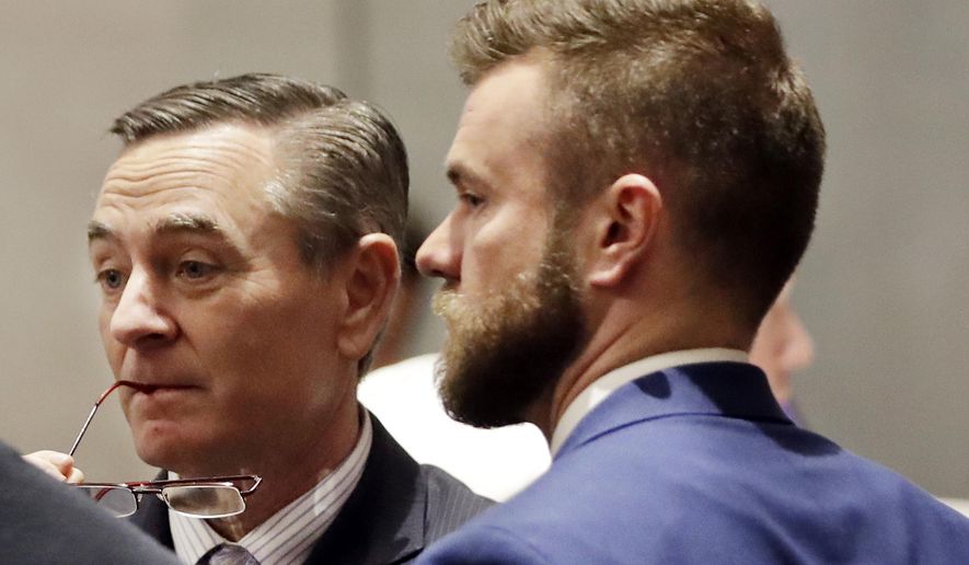 FILE - In this May 2, 2019, file photo, House Speaker Glen Casada, R-Franklin, left, talks with Cade Cothren, right, his chief of staff, during a House session in Nashville, Tenn. A news outlet reported that Casada's chief of staff, Cade Cothren, may have tampered with emails to make it look like a black student activist violated bond conditions after he was arrested for participating in protests at the Tennessee Capitol. The same report revealed Cothren had used racist language in text messages years earlier, including at least one the speaker received. (AP Photo/Mark Humphrey, File)
