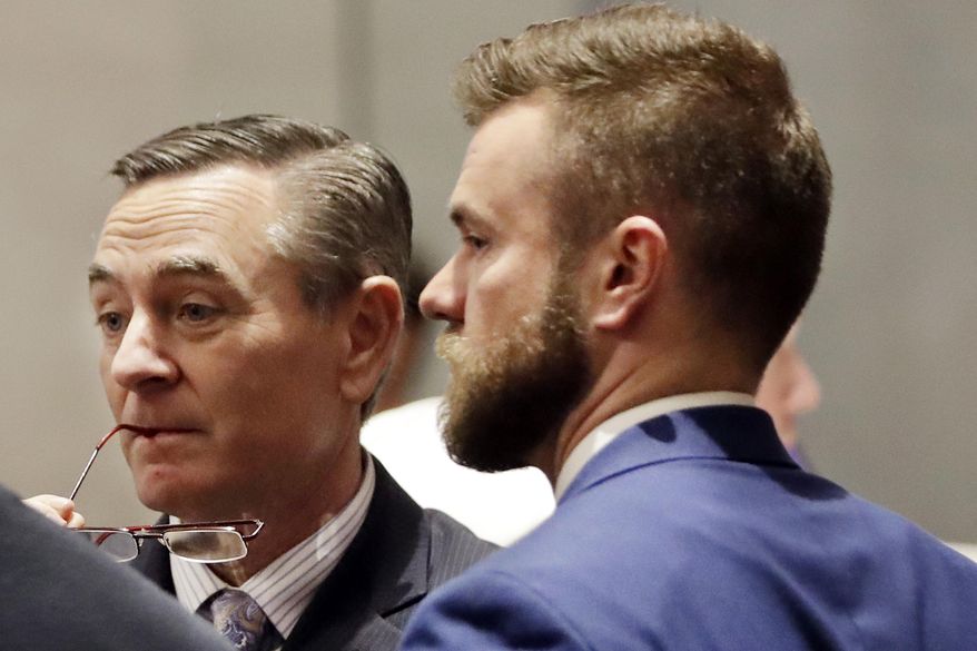 FILE - In this May 2, 2019, file photo, House Speaker Glen Casada, R-Franklin, left, talks with Cade Cothren, right, his chief of staff, during a House session in Nashville, Tenn. A news outlet reported that Casada's chief of staff, Cade Cothren, may have tampered with emails to make it look like a black student activist violated bond conditions after he was arrested for participating in protests at the Tennessee Capitol. The same report revealed Cothren had used racist language in text messages years earlier, including at least one the speaker received. (AP Photo/Mark Humphrey, File)