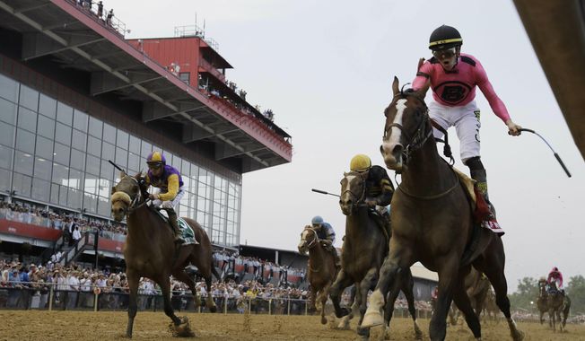 War of Will, ridden by Tyler Gaffalione, right, crosses the finish line first to win the Preakness Stakes horse race at Pimlico Race Course, Saturday, May 18, 2019, in Baltimore.(AP Photo/Steve Helber) ** FILE **