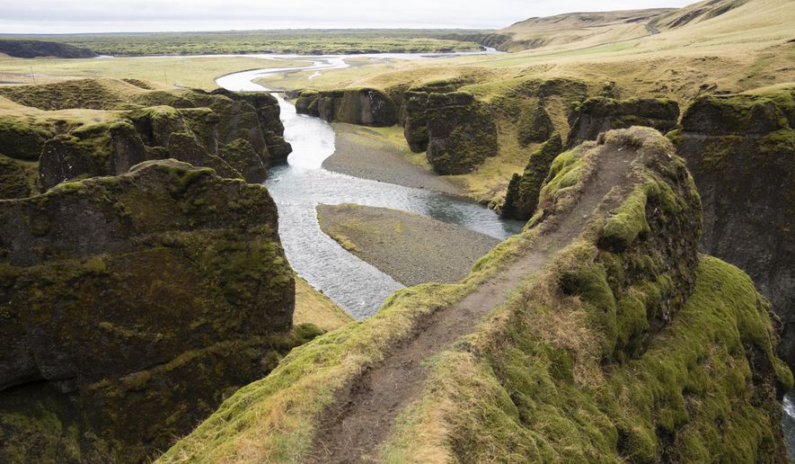 This photo taken Wednesday, May 1, 2019, shows a cliff at the Fjadrárgljúfur canyon in southeastern Iceland. The canyon area has suffered environmental damages after intense traffic, prompted by the music video &amp;quot;I&#39;ll Show You&amp;quot; by Justin Bieber. (AP Photo/Egill Bjarnason)