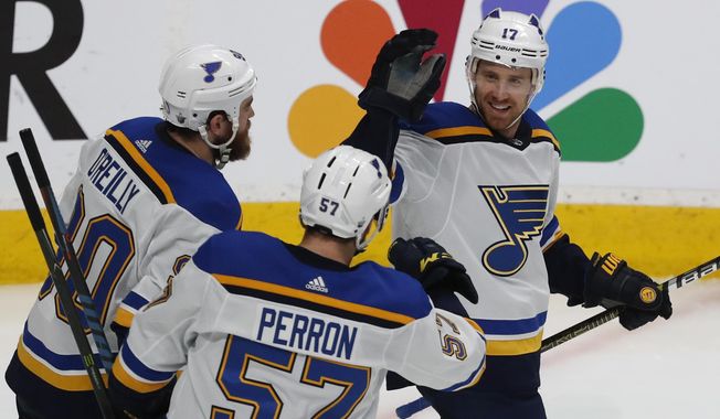St. Louis Blues&#x27; Ryan O&#x27;Reilly (90), David Perron (57), celebrate with Jaden Schwartz (17), who scored a goal against the San Jose Sharks in the third period in Game 5 of the NHL hockey Stanley Cup Western Conference finals in San Jose, Calif., on Sunday, May 19, 2019. (AP Photo/Josie Lepe)