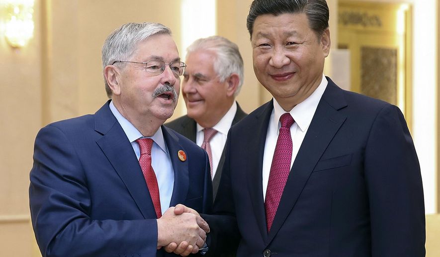 FILE - In this Sept. 30, 2017, file photo, U.S. Ambassador Terry Edward Branstad, left, shakes hands with China&#x27;s President Xi Jinping at the Great Hall of the People in Beijing. The U.S. ambassador to China is making a rare visit to Tibet to meet local officials and raise concerns about restrictions on Buddhist practices and the preservation of the Himalayan region&#x27;s unique culture and language. (Lintao Zhang/Pool Photo via AP, File)