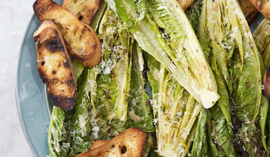 This undated photo provided by America's Test Kitchen in May 2019 shows Grilled Caesar Salad in Brookline, Mass. This recipe appears in the cookbook “Vegetables Illustrated.” (Joe Keller/America's Test Kitchen via AP)