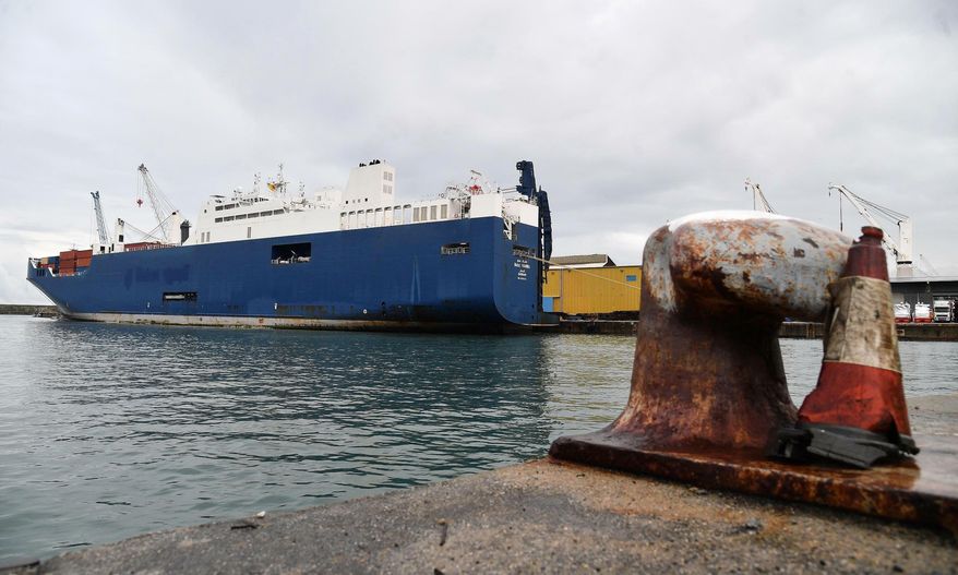 Saudi Arabian freighter Bahri Yambu is docked in Genoa's port, Italy, Monday, May 20, 2019. The freighter allegedly carrying weapons that could be used in the war in Yemen is scheduled to load further cargo before departing for the Saudi port of Jeddah late Monday despite protests by harbor workers, according to the Italian news agencies. (Luca Zennaro/ANSA via AP)