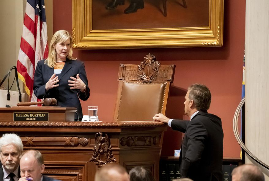 House Speaker Melissa Hortman talks with Republican House Minority Leader Kurt Daudt on the House floor Monday, May 20, 2019 at the State house in Saint Paul. glen.stubbe@startribune.com Monday, May 20, 2019. (Glen Stubbe/Star Tribune via AP)