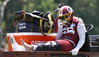 Washington Redskins linebacker Reuben Foster rides a cart off the field after suffering an injury during a practice at the team&#39;s NFL football practice facility, Monday, May 20, 2019, in Ashburn, Va. (AP Photo/Patrick Semansky)  **FILE**