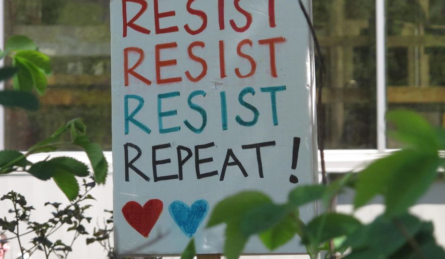 This sign was among those dotting a gathering of abortion rights advocates in Juneau, Alaska on Tuesday, May 21, 2019. Several states have taken steps to ban or severely restrict abortions, and a bill was introduced in the Alaska House that seeks to outlaw abortion. (AP Photo/Becky Bohrer)