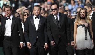 Actors Brad Pitt, from left, Leonardo DiCaprio, director Quentin Tarantino and actress Margot Robbie pose for photographers upon arrival at the premiere of the film &#39;Once Upon a Time in Hollywood&#39; at the 72nd international film festival, Cannes, southern France, Tuesday, May 21, 2019. (AP Photo/Petros Giannakouris)