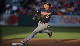 Minnesota Twins&#39; Jorge Polanco rounds second on a single by Willians Astudillo during the first inning of a baseball game against the Los Angeles Angels, Monday, May 20, 2019, in Anaheim, Calif. (AP Photo/Mark J. Terrill)