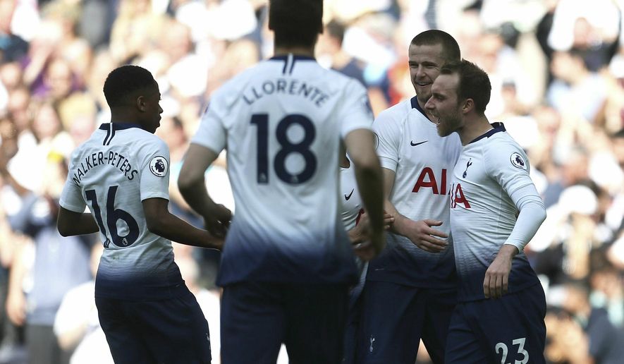 Tottenham Hotspur&#39;s Christian Eriksen, right, celebrates scoring his side&#39;s second goal of the game with team-mates during the English Premier League soccer match between Tottenham Hotspur and Everton at the Tottenham Hotspur Stadium, London. Sunday, May 12 2019. (Steve Paston/PA via AP)