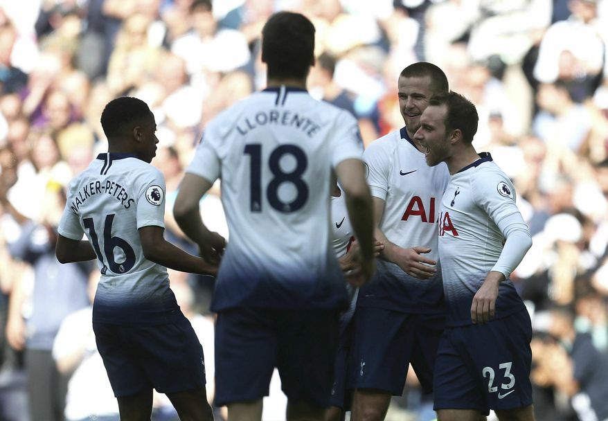 Tottenham Hotspur's Christian Eriksen, right, celebrates scoring his side's second goal of the game with team-mates during the English Premier League soccer match between Tottenham Hotspur and Everton at the Tottenham Hotspur Stadium, London. Sunday, May 12 2019. (Steve Paston/PA via AP)