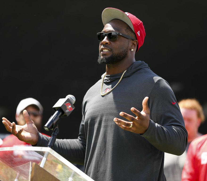 FILE - In this Sept. 18, 2018, gilr photo, Tampa Bay Buccaneers' Gerald McCoy speaks during an announcement of the NFL football team's social justice initiative at the Tampa Police Department Training Academy in Tampa, Fla. The Buccaneers are moving on from Gerald McCoy. The team released the six-time Pro Bowl defensive tackle, describing the move as a mutual agreement after nine seasons. (Monica Herndon/Tampa Bay Times via AP, File)