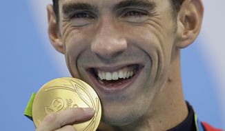 FILE - In this Aug. 9, 2016, file photo, Michael Phelps has tears in his eyes as he shows off his gold medal after the men&#39;s 200-meter butterfly final during the swimming competitions at the 2016 Summer Olympics, in Rio de Janeiro, Brazil. While swimming to Olympic glory, Phelps found comfort in the pool and quite a bit of angst out of it. Because he is willing to share his story of depression and raise awareness of mental health issues, Phelps will be awarded the fifth annual Morton E. Ruderman Award in Inclusion on Tuesday night, May 21, 2019, in Boston. (AP Photo/Michael Sohn, File)