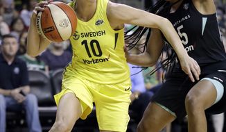 FILE - In this Aug. 17, 2018, file photo, Seattle Storm&#39;s Sue Bird (10) tries to get past New York Liberty&#39;s Brittany Boyd during the first of a WNBA basketball game, in Seattle. Sue Bird needs arthroscopic surgery on her left knee and will be out indefinitely, another big blow for the defending WNBA champs. The Storm announced Tuesday, May 21, 2019, that the 11-time All-Star has a loose body in her left knee. Bird will undergo surgery in Connecticut in the near future.(AP Photo/Elaine Thompson)