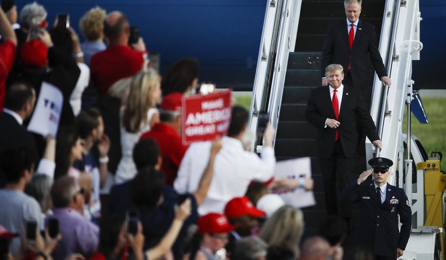 President Donald Trump accompanied by Rep. Fred Keller, R-Snyder, arrive at a campaign rally in Montoursville, Pa., Monday, May 20, 2019. (AP Photo/Matt Rourke)