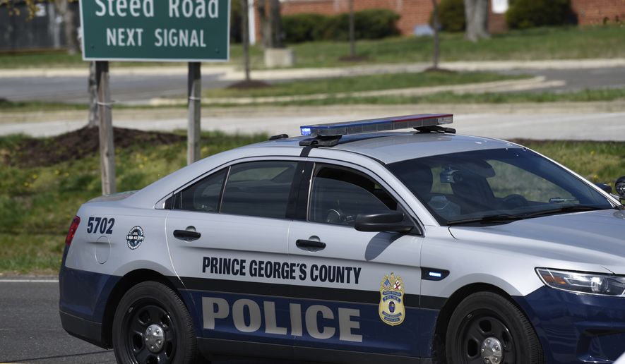 A Prince George&#39;s County, Md., police vehicle is seen near the location where a military aircraft crashed, Wednesday, April 5, 2017, in Clinton, Md. (AP Photo/Sait Serkan Gurbuz) **FILE**